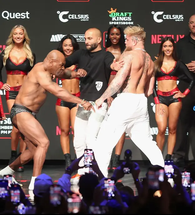 Tyson points at Paul's foot. Credit: Christian Petersen / Getty