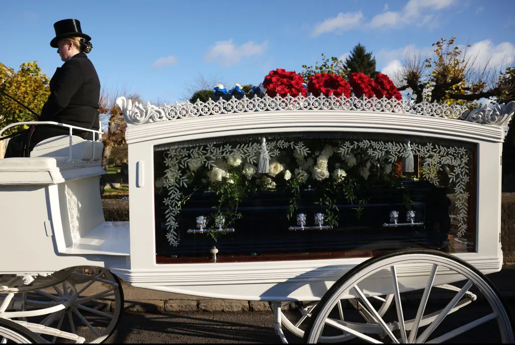 Liam Payne's coffin was brought to the church in a white carriage with floral tributes reading "son" and "daddy" on top of the vehicle. Credit: Dan Kitwood/Getty Images