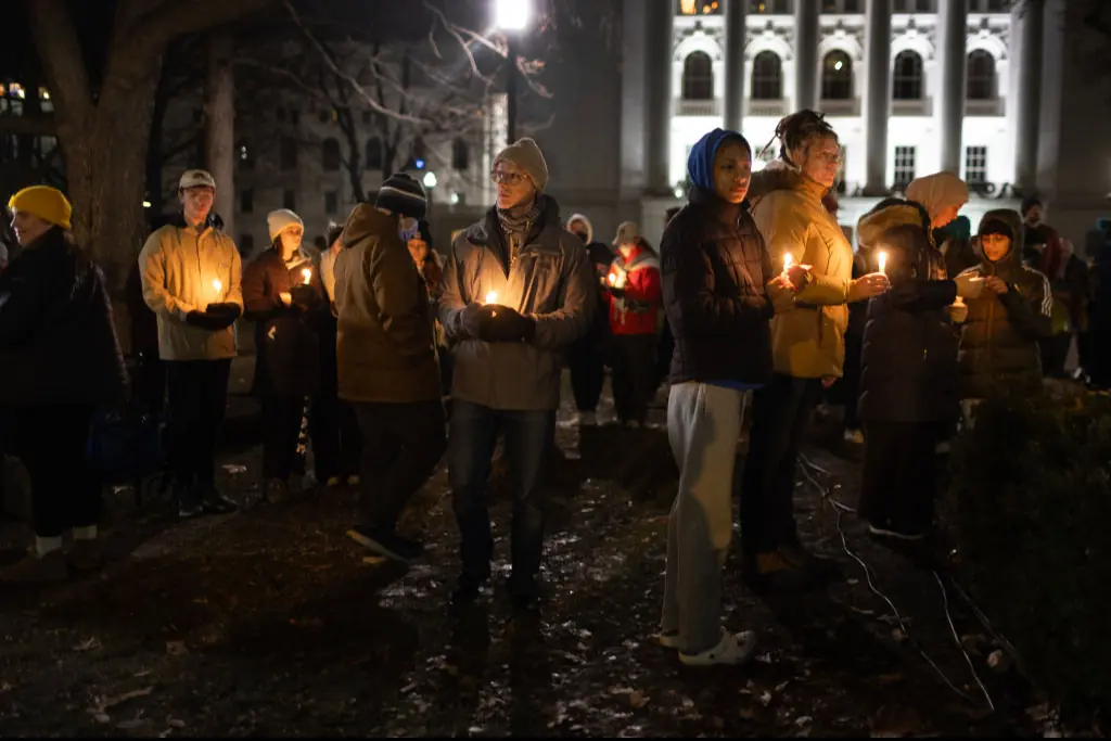 People attended a vigil on the grounds of the state Capital building to mourn the victims of the shooting at Abundant Life Christian School. Credit: Getty