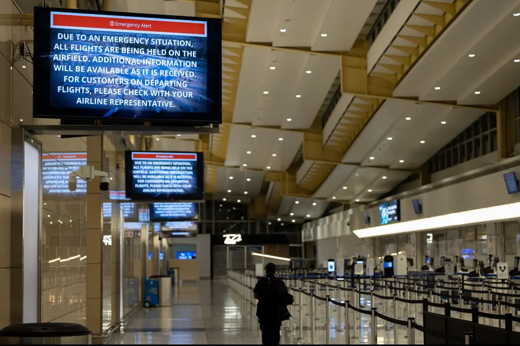 Signage displays an emergency message inside Ronald Reagan National Airport. Credit: Nathan Posner/Anadolu via Getty Images