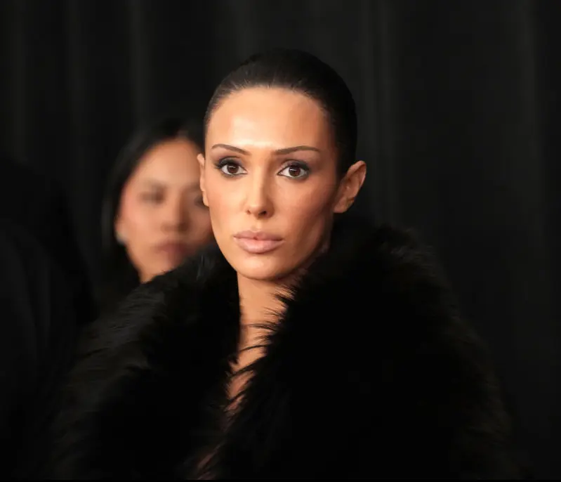Bianca Censori initially turned up covered in a large black coat. Credit: Jeff Kravitz / Getty