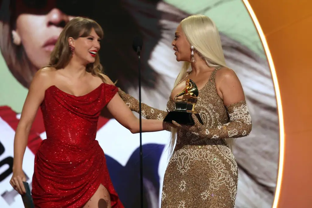 Taylor presents Beyonce with the Country Album of the Year award. Credit: Kevin Mazur/Getty Images for The Recording Academy