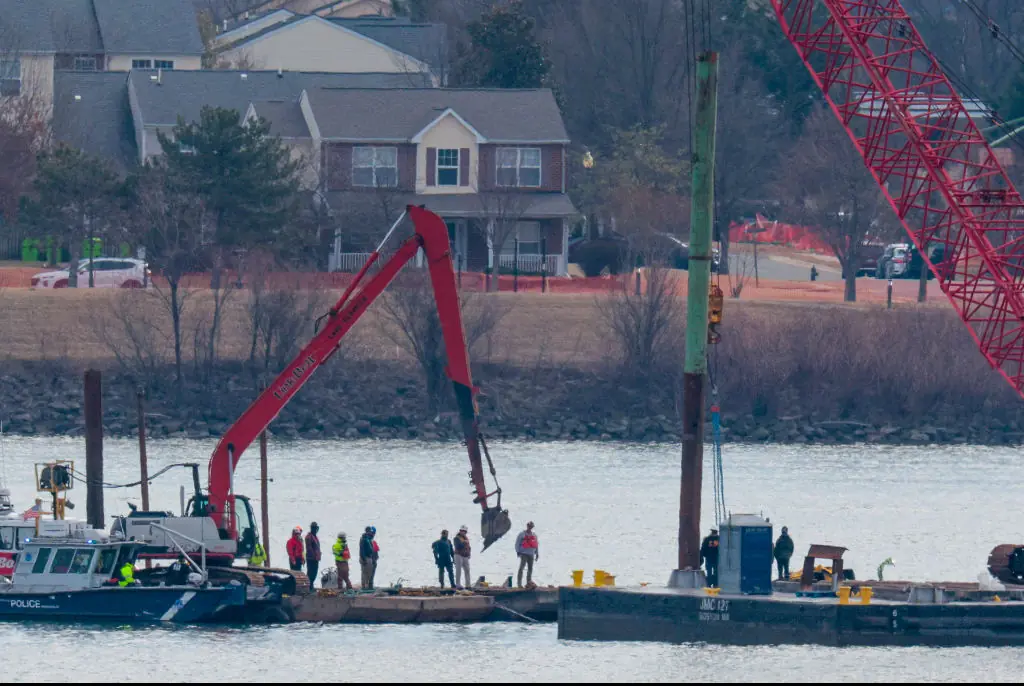 Cranes have started removing parts of the wreckage from the Potomac River. Credit: Chip Somodevilla/Getty Images