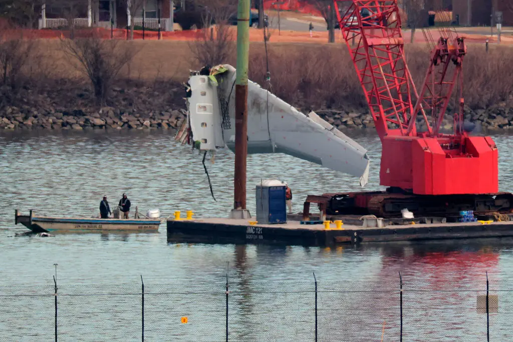 A wing from American Airlines flight 5342 is removed. Credit: Chip Somodevilla/Getty Images