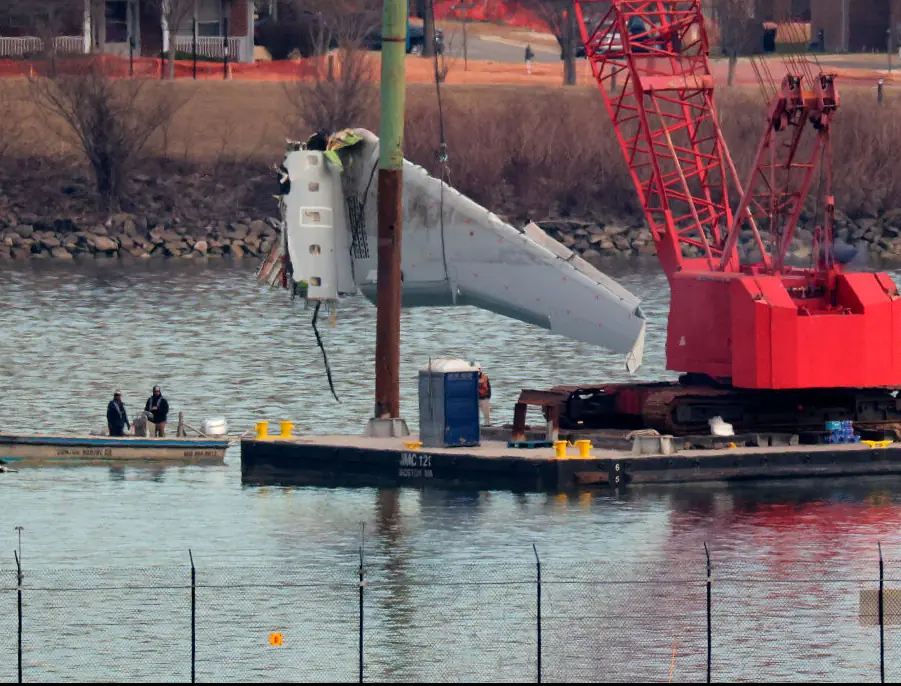 A wing from American Airlines flight 5342 is removed. Credit: Chip Somodevilla/Getty Images