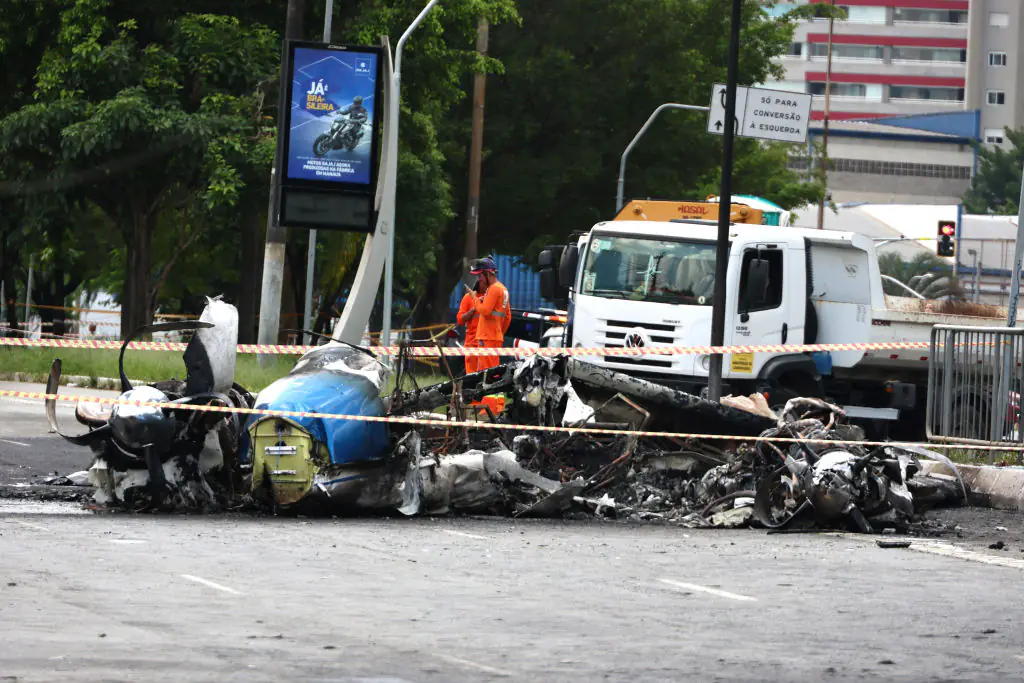The small plane crashed into the busy neighborhood. Credit: Fabio Vieira/FotoRua/NurPhoto via Getty Images