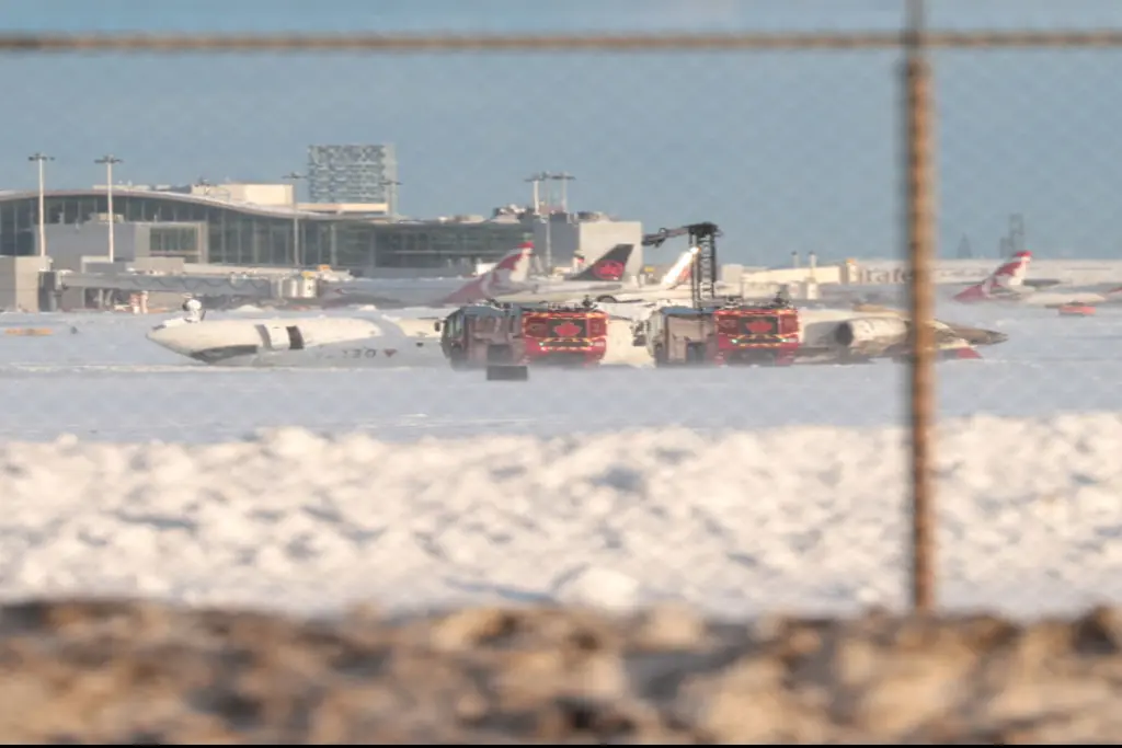 Delta Air Line's Endeavor Flight 4819 seen laying on the runway in Toronto. Credit:  Mert Alper Dervis /Anadolu via Getty Images