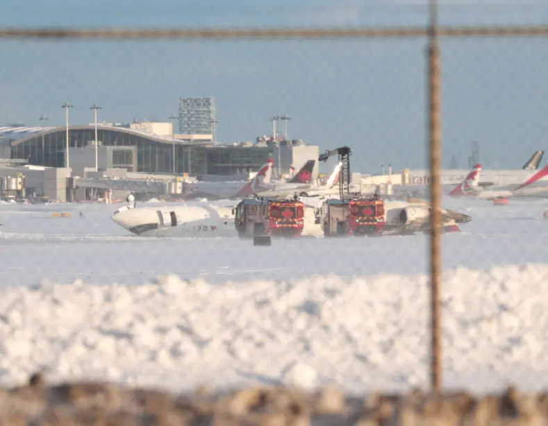 Delta Air Line's Endeavor Flight 4819 seen laying on the runway in Toronto. Credit:  Mert Alper Dervis /Anadolu via Getty Images