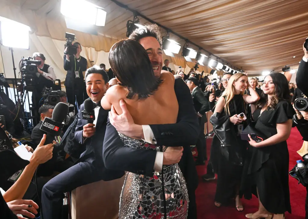 Why Halle Berry was seen kissing Adrien Brody on Oscars red carpet... in front of his girlfriend