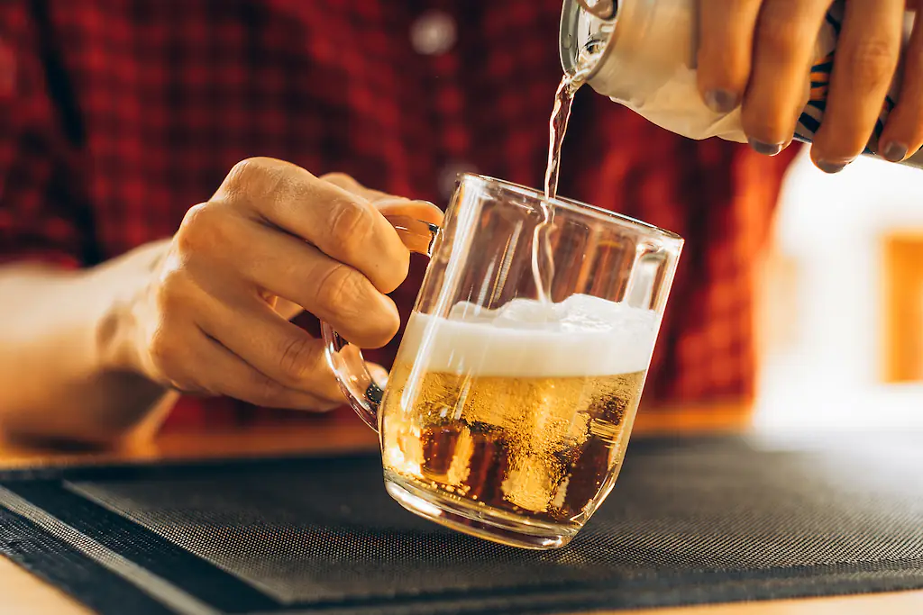 A TikToker has showed his transformation after four months of taking steroids, avoiding the gym and drinking 24 beers every day. credit: Milky Way / Getty