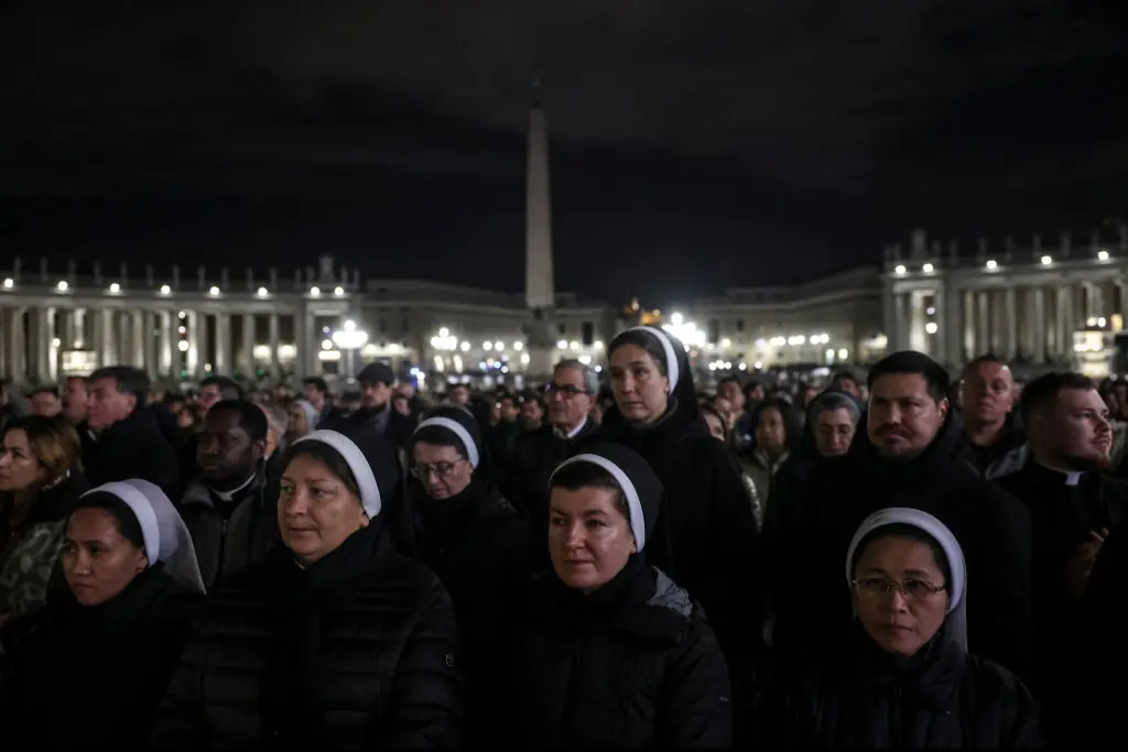  Nuns and the faithful attend Rosary prayers at St. Peter's Square on February 28. Credit:  Alessandra Benedetti - Corbis/Corbis via Getty Images