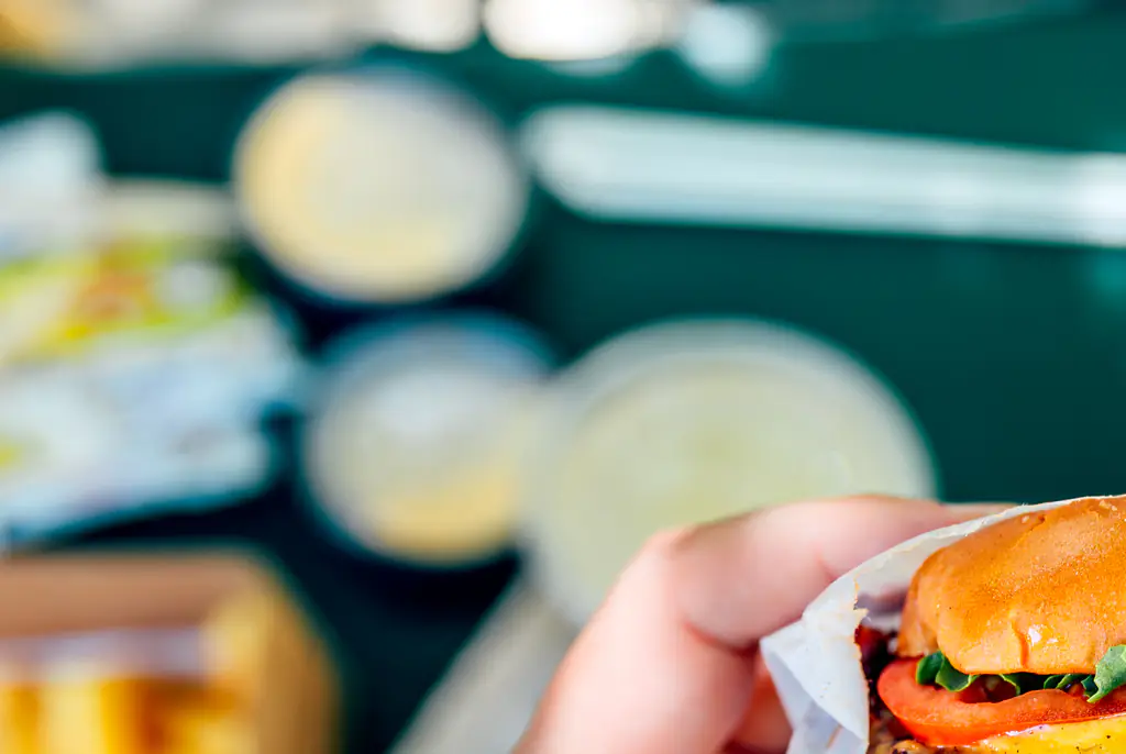 Food influencers hit by a car while reviewing a burger inside restaurant