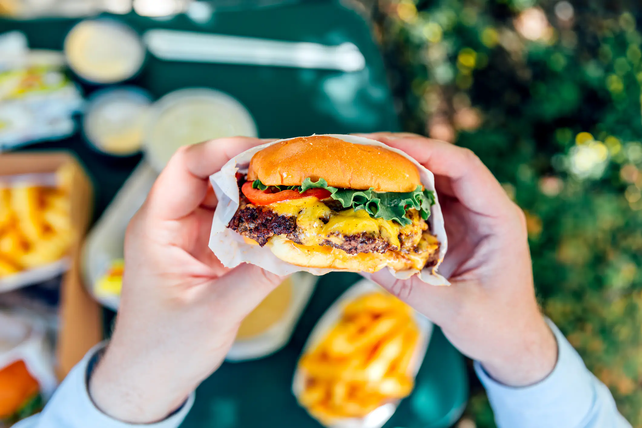 Food influencers hit by a car while reviewing a burger inside restaurant