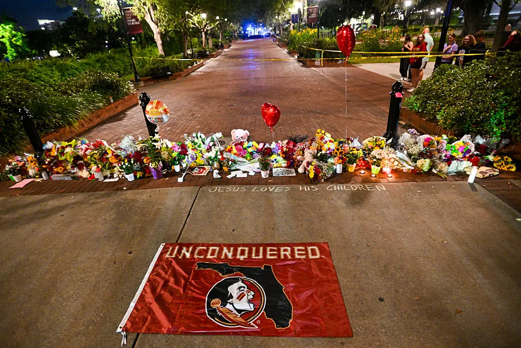 Flowers and tributes laid on campus grounds. Credit: Miguel J. Rodriguez Carrillo / Getty