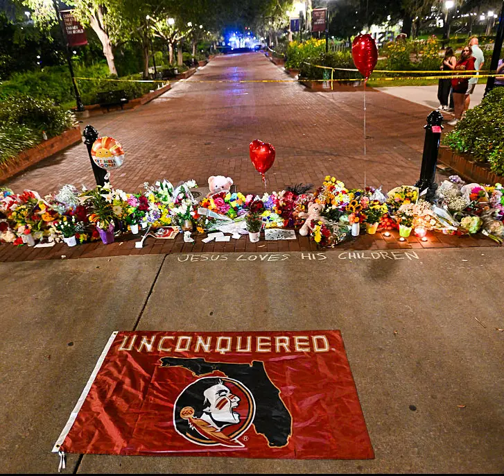 Flowers and tributes laid on campus grounds. Credit: Miguel J. Rodriguez Carrillo / Getty