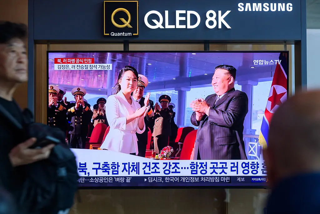 Seoul Railway Station showing a news broadcast with the Kim Jong Un and his daughter attending a launch ceremony. Credit: SOPA Images / Getty