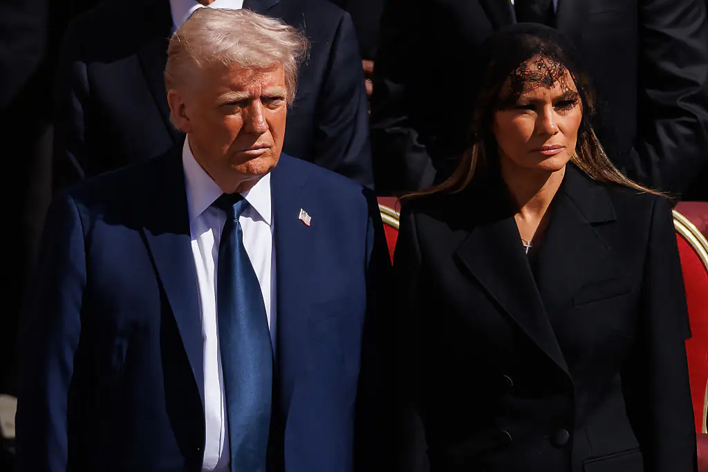 Lip reader revealed Trump’s 7-word whisper to Melania. Credit: Dan Kitwood / Getty