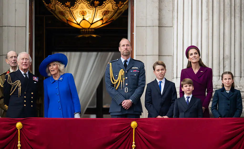 King Charles, Queen Camilla, Prince William, Prince George, Prince Louis, Princess Catherine, and Princess Charlotte during the military procession to mark the 80th anniversary of VE Day. Credit: Samir Hussein / Getty