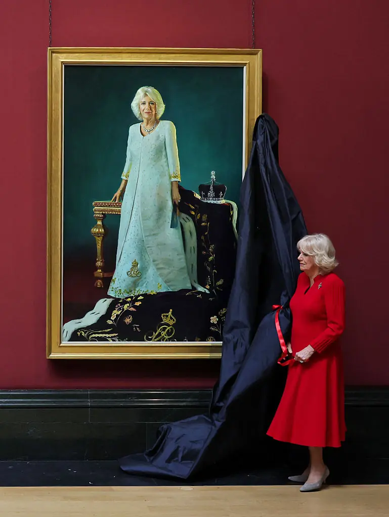 Queen Camilla next to her portrait. Credit: Chris Jackson / Getty
