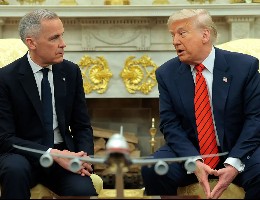 U.S. President Donald Trump speaks to reporters alongside Canadian Prime Minister Mark Carney in the Oval Office. Credit: Anna Moneymaker / Getty
