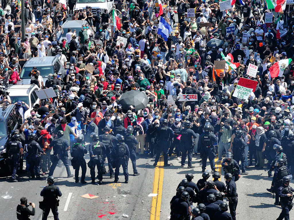 Hundreds of LA protesters gather to demand an immediate end to Immigration and Customs Enforcement (ICE) workplace raids. Credit: Anadolu / Getty