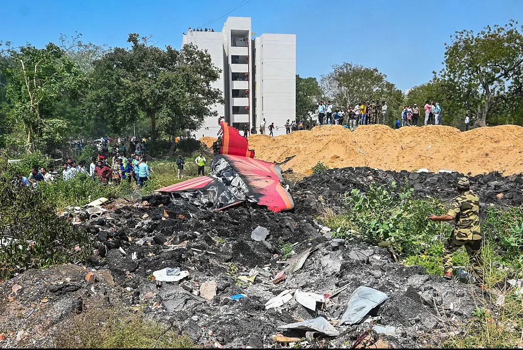 Rescue efforts take place at the site of the Air India flight crash. Credit: NurPhoto / Getty