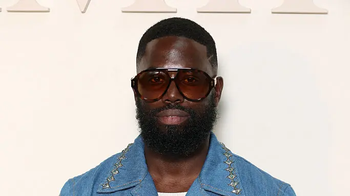 PARIS, FRANCE - JUNE 26: (EDITORIAL USE ONLY - For Non-Editorial use please seek approval from Fashion House) Ghetts attends the Amiri Menswear Spring/Summer 2026 show as part of Paris Fashion Week on June 26, 2025 in Paris, France. (Photo by Pascal Le Segretain/Getty Images)