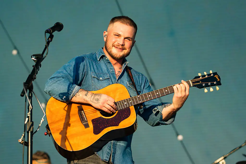 Wild video captures country singer Zach Bryan scaling fence to fight fellow star Gavin Adcock