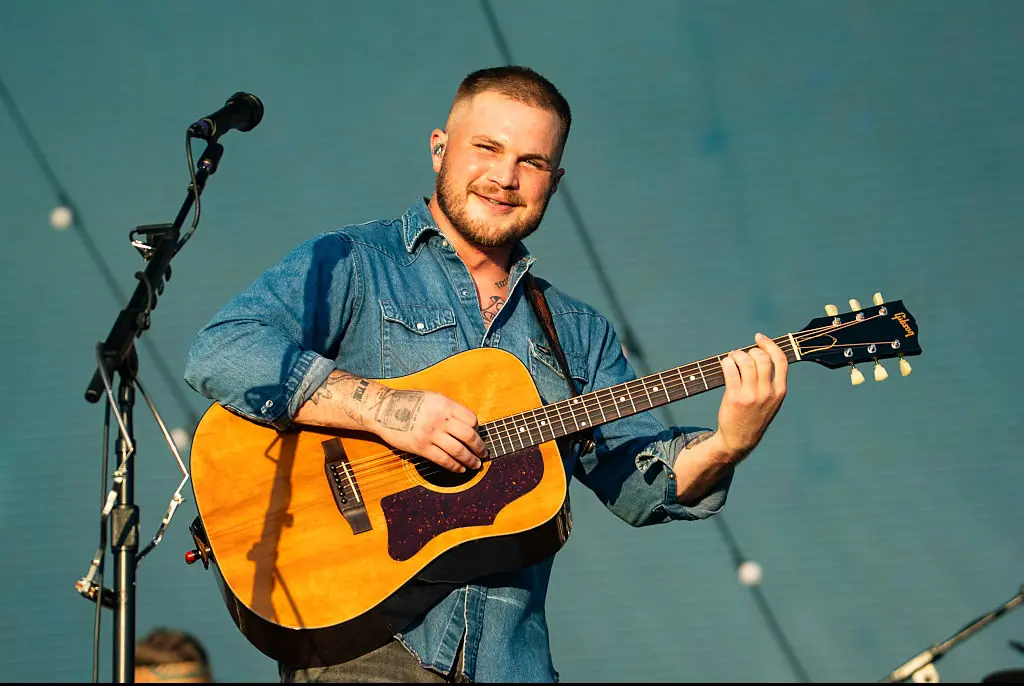 Wild video captures country singer Zach Bryan scaling fence to fight fellow star Gavin Adcock