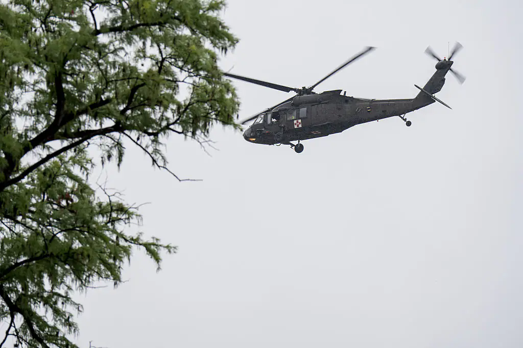 A UH-60 Black Hawk helicopter conducts rescue operations along the Guadalupe River. Credit: Eric Vryn / Getty