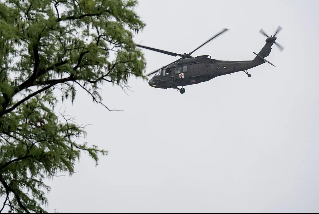 A UH-60 Black Hawk helicopter conducts rescue operations along the Guadalupe River. Credit: Eric Vryn / Getty