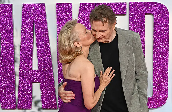 Pamela Anderson kisses Liam Neeson on red carpet after star admitted being 'madly in love' with her