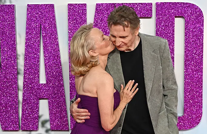 Pamela Anderson kisses Liam Neeson on red carpet after star admitted being 'madly in love' with her