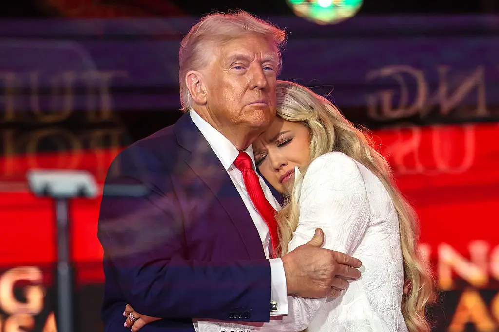 Erika Kirk and Donald Trump hugging onstage during the memorial service for Charlie Kirk. Credit: Win McNamee / Getty