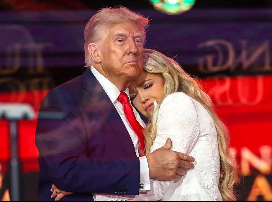 Erika Kirk and Donald Trump hugging onstage during the memorial service for Charlie Kirk. Credit: Win McNamee / Getty