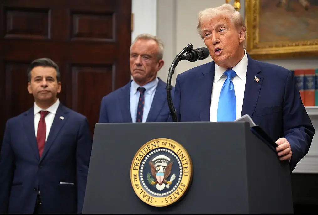 President Donald Trump, accompanied by Health and Human Services Secretary Robert F. Kennedy Jr. and Food and Drug Administration Commissioner Dr. Marty Makary. Credit: Andrew Harnik / Getty