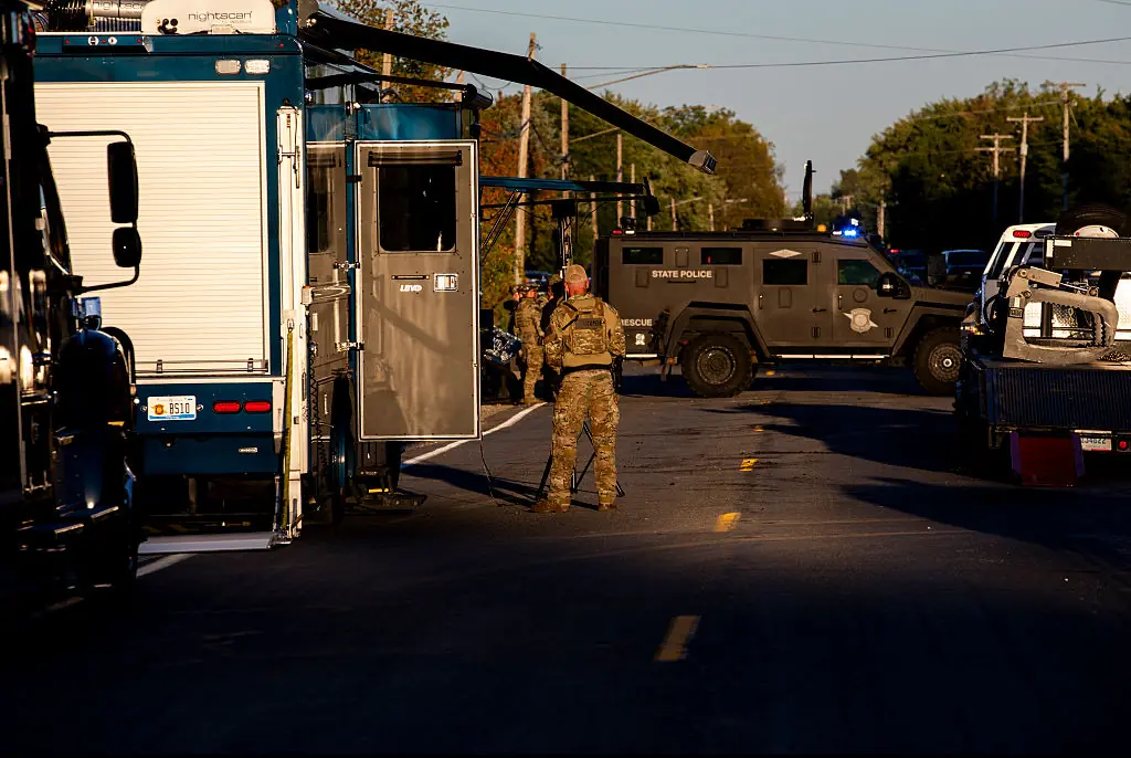 Michigan State Police and Michigan State Bomb Squad outside the suspect's residence on September 28. Credit: Emily Elconin / Getty