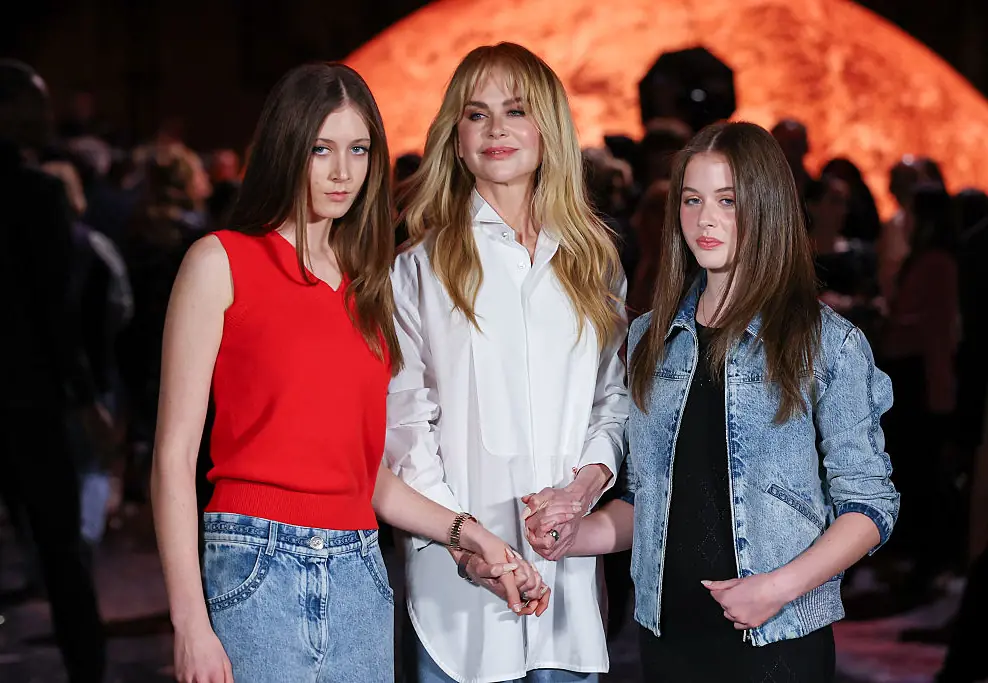 Nicole Kidman with daughters Sunday Rose and Faith Margaret at the Chanel Womenswear Spring/Summer 2026 show. Credit: Stephane Cardinale - Corbis / Getty