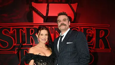 HOLLYWOOD, CALIFORNIA - NOVEMBER 06: (L-R) Millie Bobby Brown and David Harbour attend Netflix's "Stranger Things" Season 5 World Premiere at TCL Chinese 6 Theatres on November 06, 2025 in Hollywood, California. (Photo by Jerod Harris/Getty Images for Netflix)