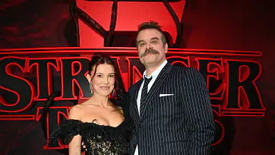 HOLLYWOOD, CALIFORNIA - NOVEMBER 06: (L-R) Millie Bobby Brown and David Harbour attend Netflix's "Stranger Things" Season 5 World Premiere at TCL Chinese 6 Theatres on November 06, 2025 in Hollywood, California. (Photo by Jerod Harris/Getty Images for Netflix)