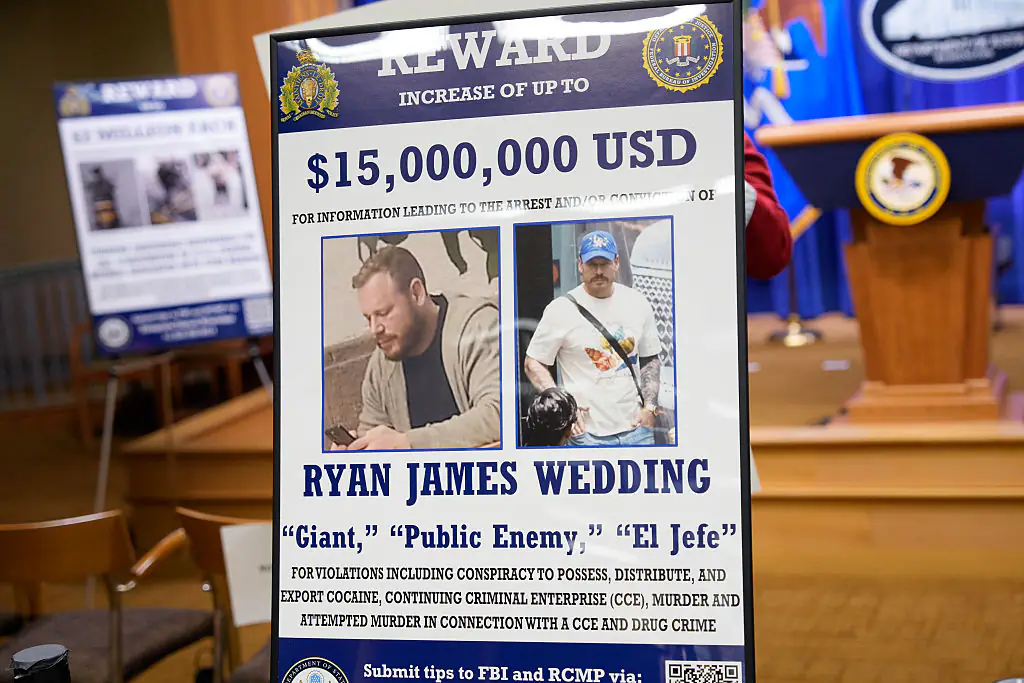 A reward poster for the arrest of Ryan Wedding. Credit: Andrew Harnik / Getty