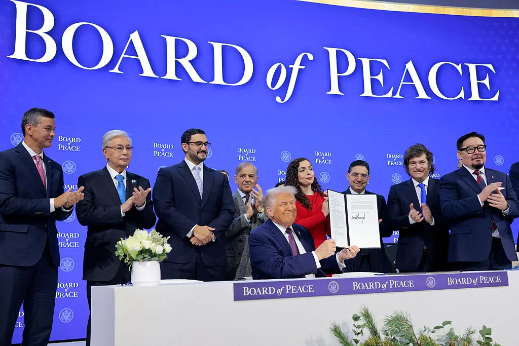 President Donald Trump held up his signature on the founding charter during a signing ceremony for the “Board of Peace” at the World Economic Forum. Credit:	Chip Somodevilla / Getty