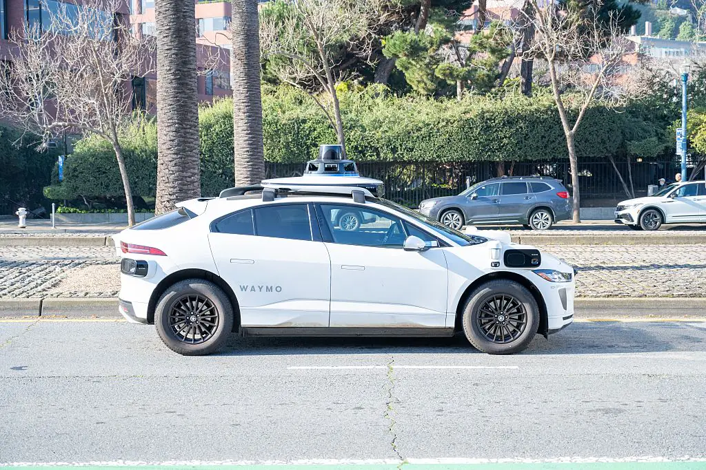 Self-driving vehicles like Waymo taxis could soon replace drivers. Credit:  Smith Collection/Gado/Getty Images