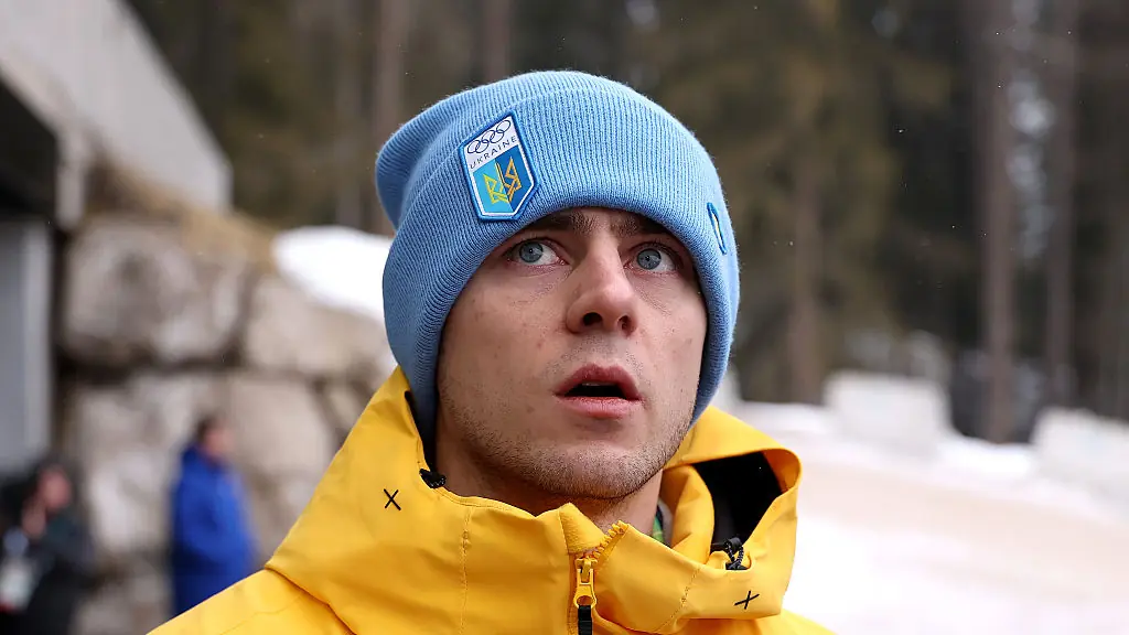 CORTINA D'AMPEZZO, ITALY - FEBRUARY 12: Vladyslav Heraskevych of Team Ukraine reacts after being disqualified from competition in the Men's Skeleton on day six of the Milano Cortina 2026 Winter Olympic games at Cortina Sliding Centre on February 12, 2026 in Cortina d'Ampezzo, Italy. (Photo by Richard Heathcote/Getty Images)