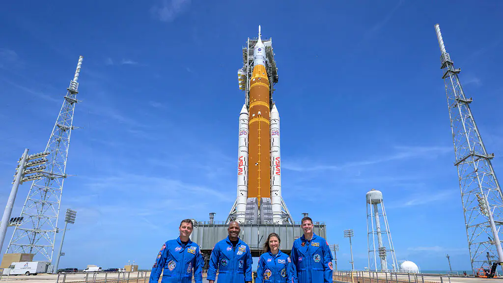 NASA Prepares For Artemis II Moon Mission CAPE CANAVERAL, FLORIDA - MARCH 30: (EDITOR'S NOTE: This Handout image was provided by a third-party organization and may not adhere to Getty Images' editorial policy.) In this handout provided by NASA, NASA astronauts Reid Wiseman, Artemis II commander, left, Victor Glover, Artemis II pilot, Christina Koch, Artemis II mission specialist, and CSA (Canadian Space Agency) astronaut Jeremy Hansen, Artemis II mission specialist, right, stop for a group photograph as they visit NASA's Artemis II SLS (Space Launch System) rocket and Orion spacecraft, on March 30, 2026 in Cape Canaveral, Florida. NASA is aiming for an early April launch date for the first crewed moon mission in 50 years. (Photo by Bill Ingalls/NASA/Getty Images)