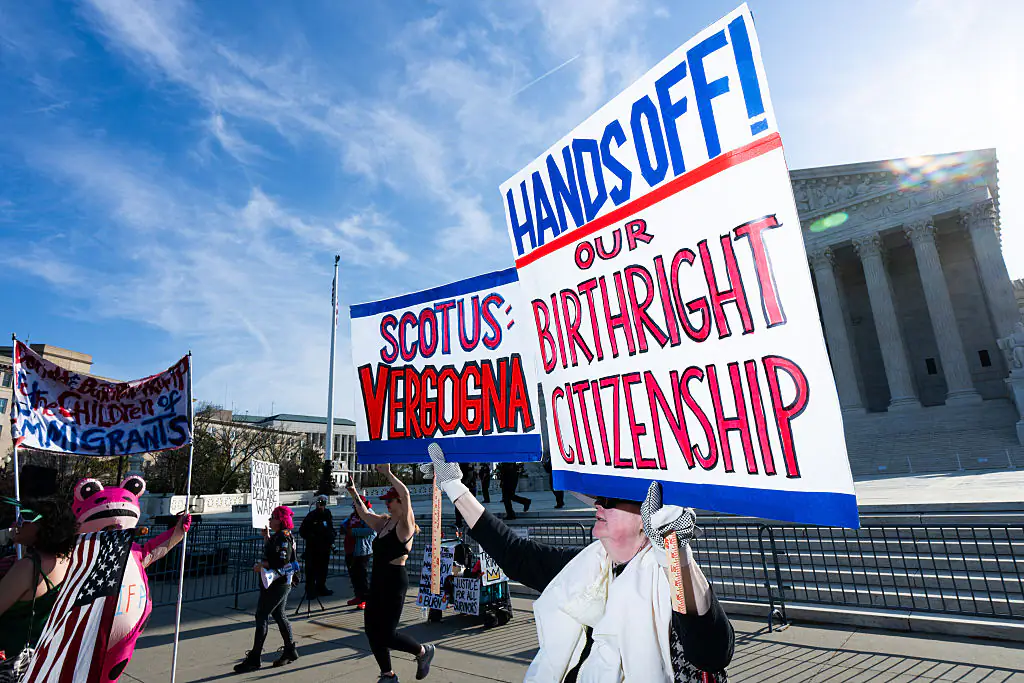 Protesters hold signs supporting birthright citizenship outside the Supreme Court on April 1. Credit: Bill Clark / Getty