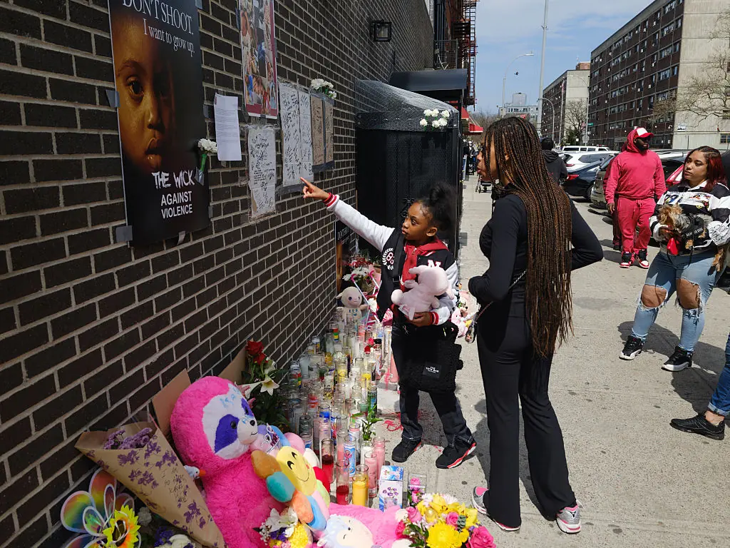 The community laid flowers, toys, and candles at the scene. Credit: Andrew Lichtenstein/ Corbis via Getty Images
