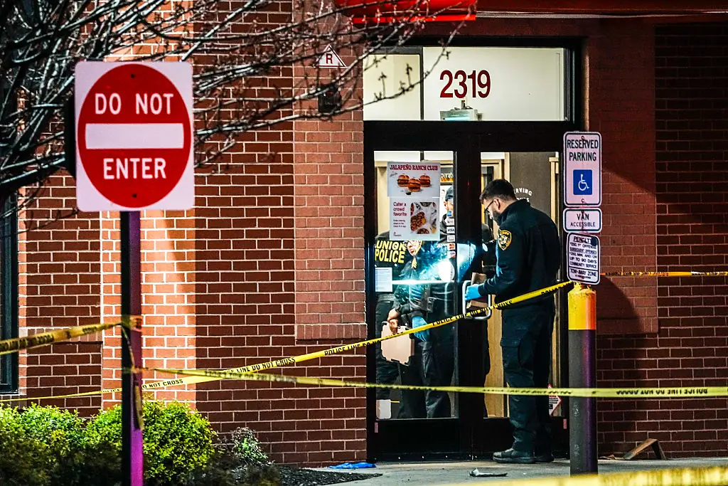 A man who said his girlfriend worked at the location said the masked men charged into the restaurant, forced their way behind the counter, and fired multiple shots. Credit: VIEWpress / Getty