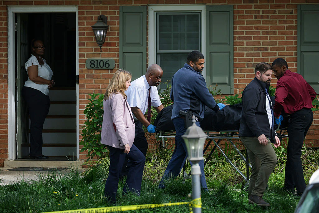 A body is removed on a gurney from a crime scene outside the home of former Virginia Lt Gov Justin Fairfax on April 16. Credit: Alex Wong / Getty