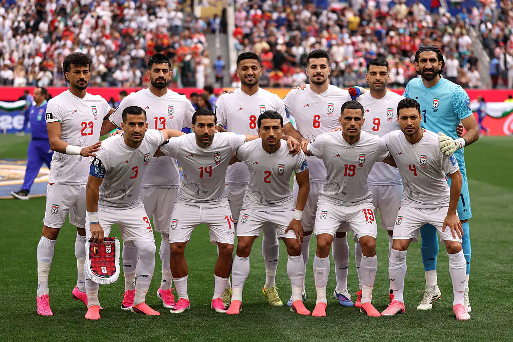 Iran pose for a team photograph before their match against Belgium. Credit: Richard Heathcote/Getty Images